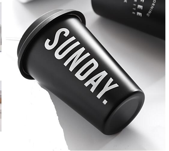 Black tumbler with 'SUNDAY.' text on a white background