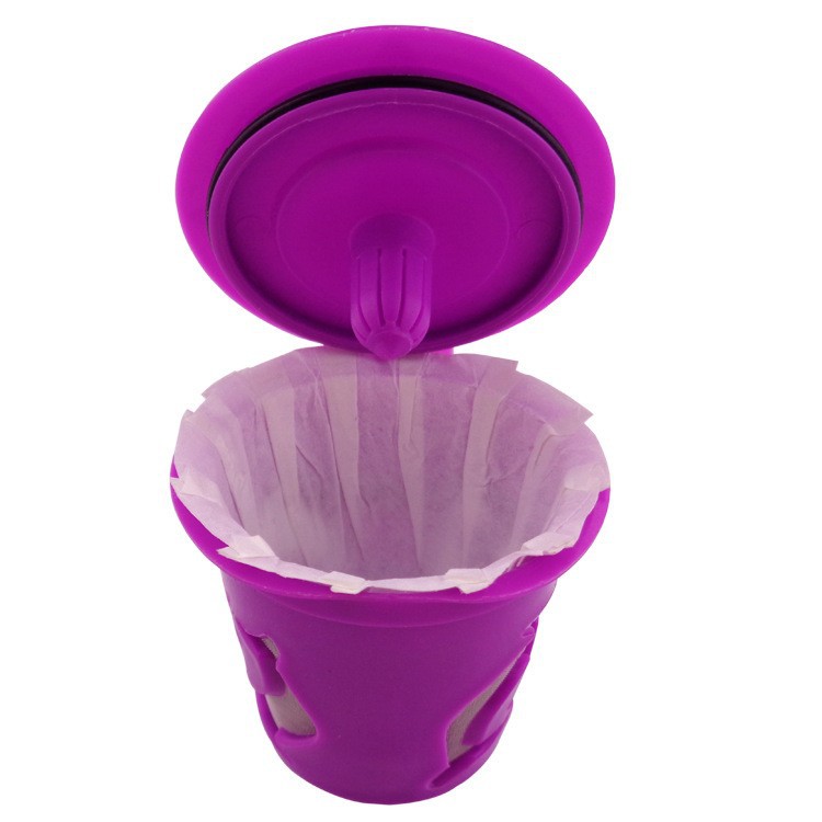 Purple silicone coffee filter with a clear plastic component on a white background