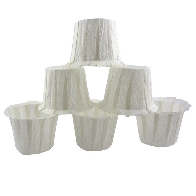 Stack of white paper muffin cups on a white background